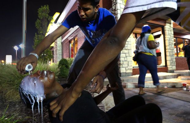 Tear gas fired as marchers moved toward police command post